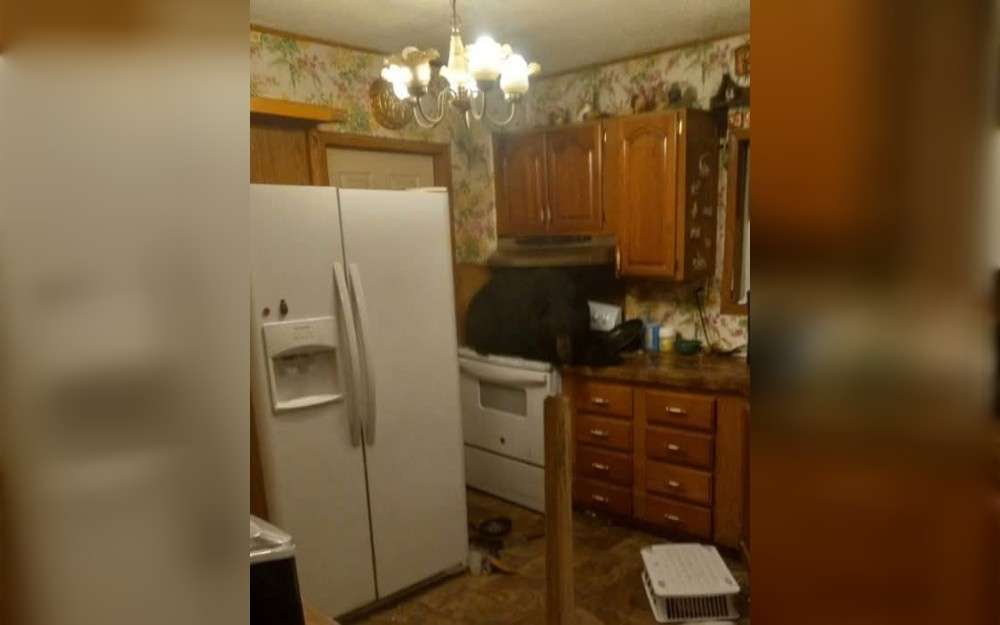 After smashing through a home's ceiling, a black bear was discovered resting on a stove in Bell County, Kentucky on May 21. A bear inside a home prompted a call to Game Warden Derick Creech. Creech found the bear sitting on the kitchen stove, where it had fallen from the attic above through the ceiling.