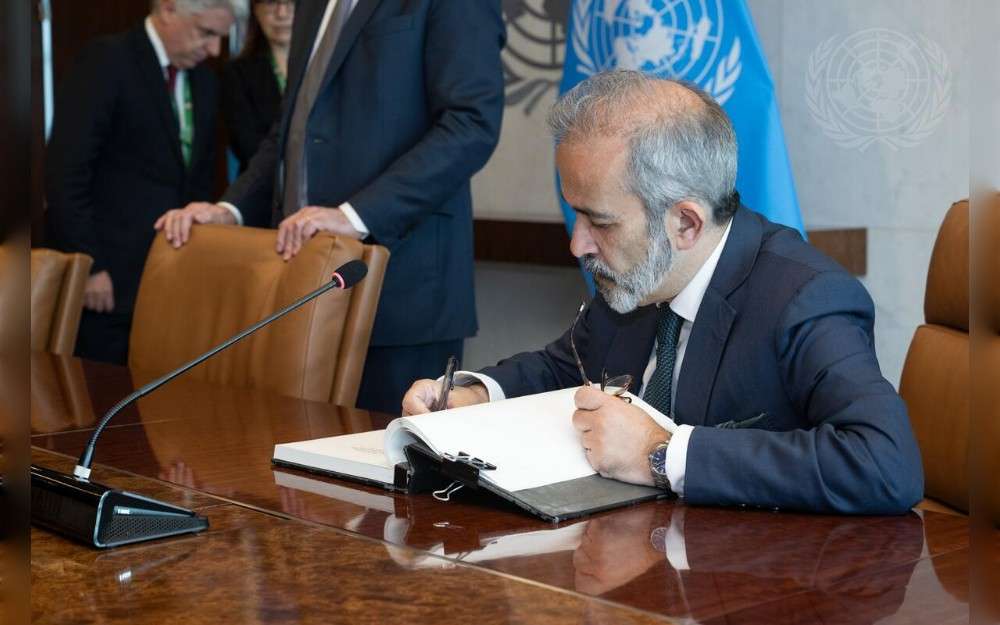 Paulo Rangel, Minister of State and Foreign Affairs of Portugal signs the guest book during a meeting with United Nations Secretary-General António Guterres.